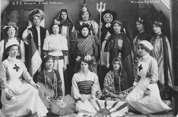 GFS Concert final tableau with girls in national costumes